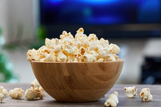 istock Large wooden bowl with popcorn 1298643378