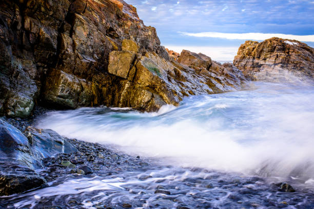 Crashing Wave A wave crashes on the rocky coast of Maine rocky coastline stock pictures, royalty-free photos & images