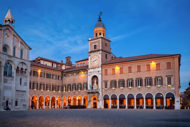 building of Town Hall at dusk in Modena, Italy stock photo
