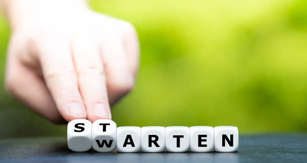 istock Hand turns dice and changes the German word 