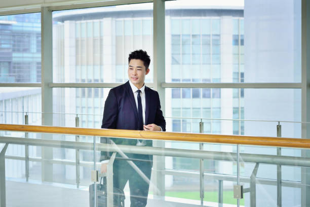 istock One Asian Man Walking in Corridor 1298645665