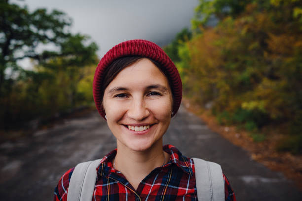 istock Happy Asian girl backpack in road and forest background 1298646785
