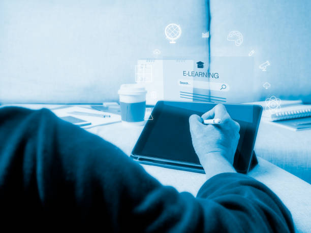 istock Man touching on tablet's screen with learning icons at home. E-learning Education and Online Courses concept 1298647897