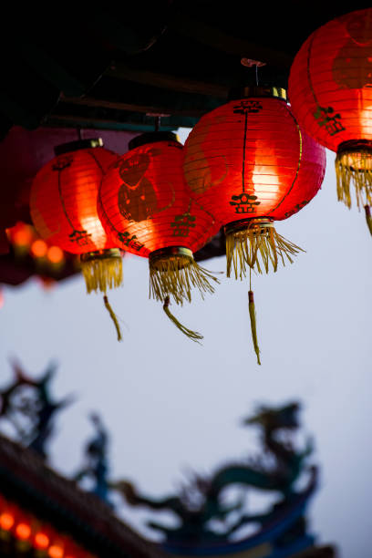 istock Rows of colorful glowing red Chinese lanterns 1298648243