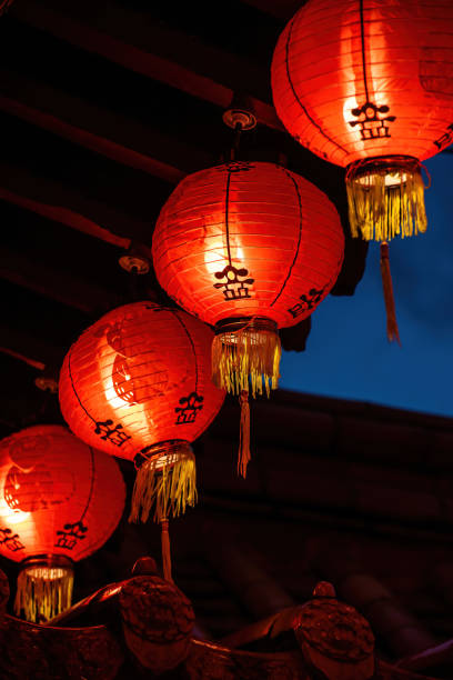 istock Rows of colorful glowing red Chinese lanterns 1298648244