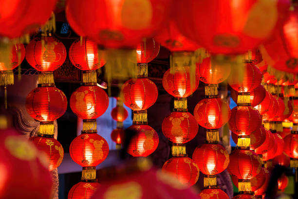 istock Rows of colorful glowing red Chinese lanterns 1298648287