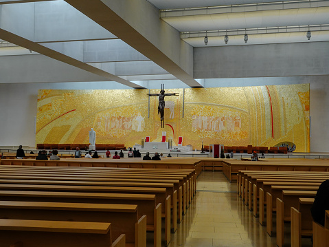 Fatima, Santarem, Portugal- June 9, 2019: Interior view of the pews and altar of the Basilica of the Holy Trinity, Fatima, Portugal.