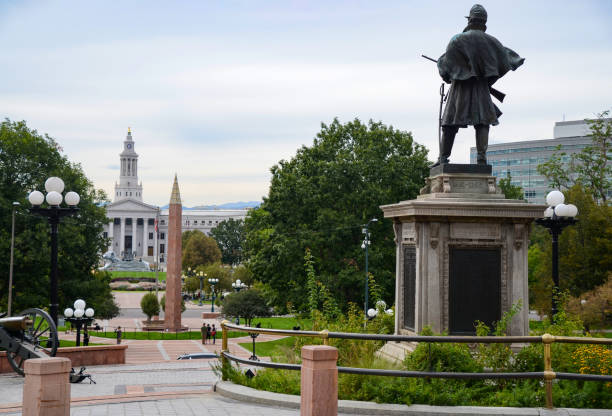 View of the Denver City and County Building from the Steps of the Denver Capitol Building 09/23/2019 - Denver, Colorado - View of the Denver City and County Building across Civic Center Park from the steps of the Denver Capitol Building with a view of the The Civil War Monument, which is a statue of a Civil War cavalryman by Jack Howland, installed outside the Colorado State Capitol in Denver. civic center park stock pictures, royalty-free photos & images