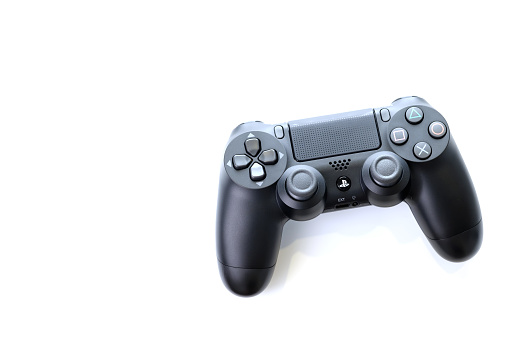 Bangkok, Thailand - January 12, 2021: The new Sony Dualshock 4 with PlayStation 4. Sony PlayStation 4 game console of the eighth generation.