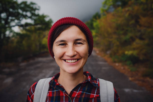 istock Happy Asian girl backpack in road and forest background 1298655470
