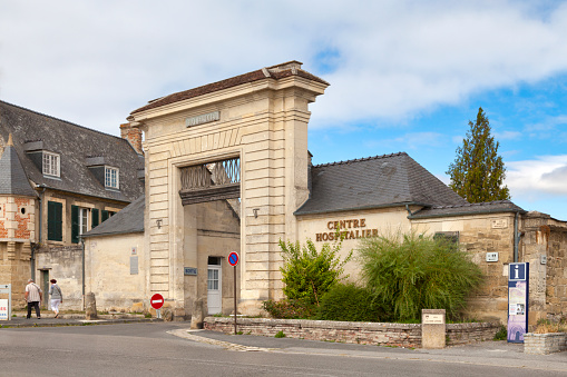 Laon, France - September 08 2020: Entrance to the former Hôtel-Dieu of the Abbey of St Martin which is now the city's hospital center.