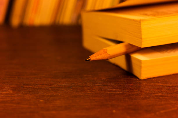 Males have a large pencil in hand