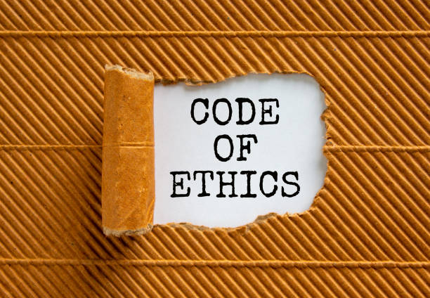 istock The words 'code of ethics' appearing behind torn brown paper. Beautiful background. Business concept. 1298659397