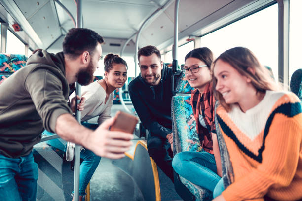 istock Selfie Time For Smiling Friends In Bus 1298660192
