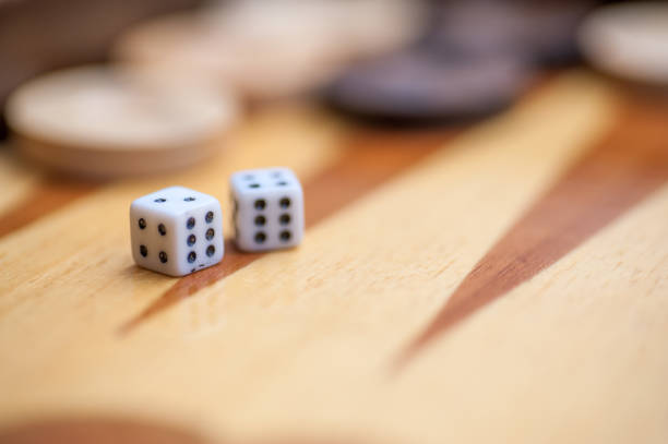 istock Close up of dice on backgammon board 1298663821