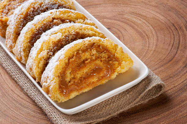 istock Swiss roll cake stuffed with dulce de leche. Roulade cake. 1298664231