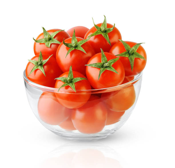 istock Isolated cherry tomatoes in a glass bowl 1298664500