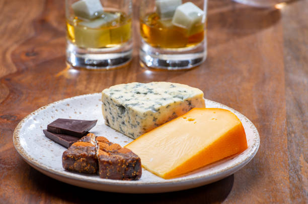 istock Tasting and pairing of different cheeses with strong alcoholic drinks, whisky, cognac or calvados 1298664685