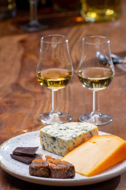 istock Tasting and pairing of different cheeses with strong alcoholic drinks, whisky, cognac or calvados 1298664687
