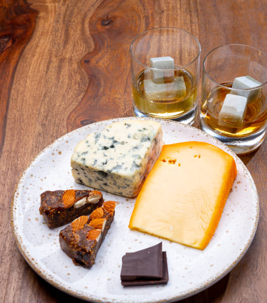 istock Tasting and pairing of different cheeses with strong alcoholic drinks, whisky, cognac or calvados 1298664695