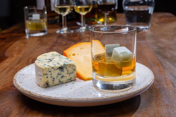 istock Tasting and pairing of different cheeses with strong alcoholic drinks, whisky, cognac or calvados 1298664698