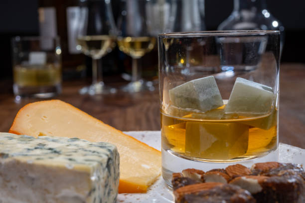 istock Tasting and pairing of different cheeses with strong alcoholic drinks, whisky, cognac or calvados 1298664699