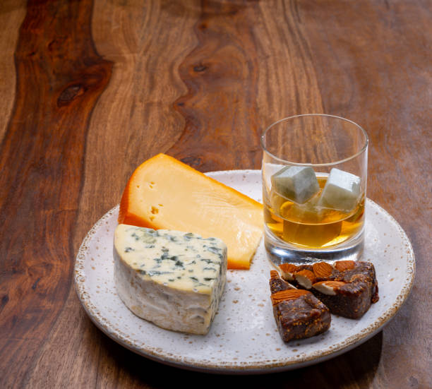 istock Tasting and pairing of different cheeses with strong alcoholic drinks, whisky, cognac or calvados 1298664705