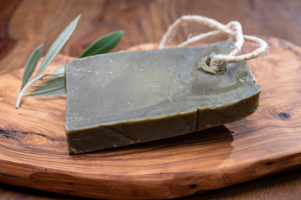 Block of handmade bio vegetal natural olives and bay leaf soap Green block of handmade bio vegetal natural olives and bay leaf soap from Provence, France savon stock pictures, royalty-free photos & images