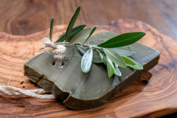 Block of handmade bio vegetal natural olives and bay leaf soap Green block of handmade bio vegetal natural olives and bay leaf soap from Provence, France savon stock pictures, royalty-free photos & images