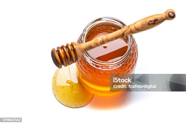 Honey Jar And Honey Dipper Shot From Above On White Background Copy Space Stock Photo - Download Image Now