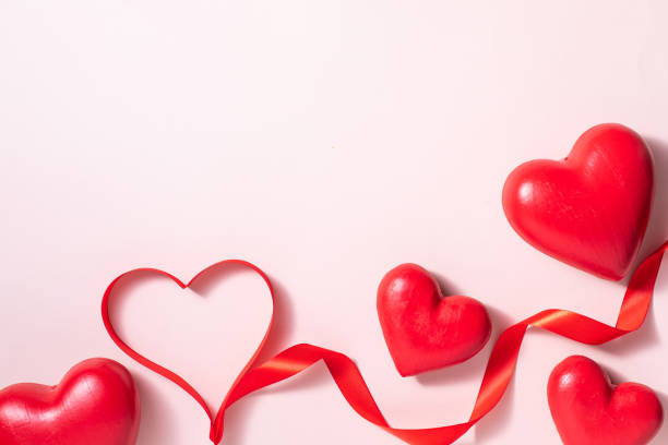 istock Valentine day composition with gift box and red hearts, photo template on pink background. 1298672138