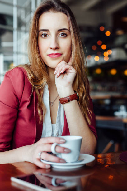 istock Woman In A Cafe 1298679332