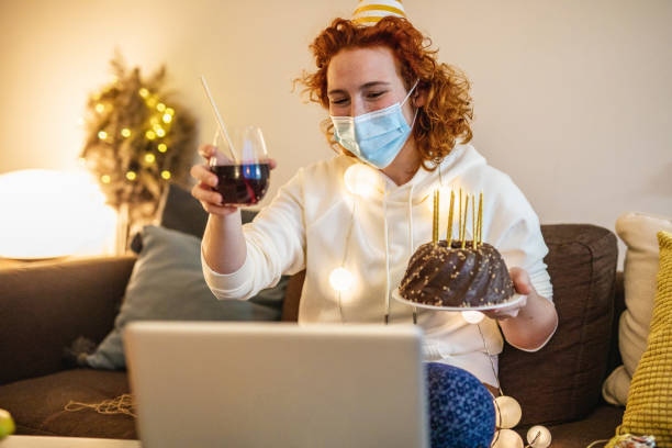 istock Social distancing and celebrating birthday on a video call 1298680576