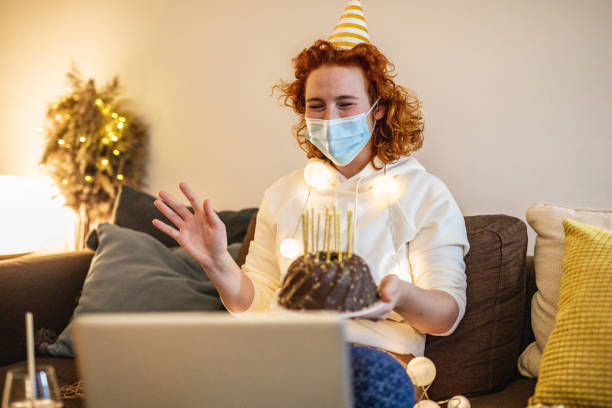 istock Social distancing and celebrating birthday on a video call 1298681002