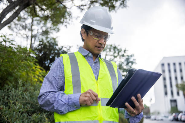 istock Mature Filipino Man with Tablet Inspecting a Building 1298681076