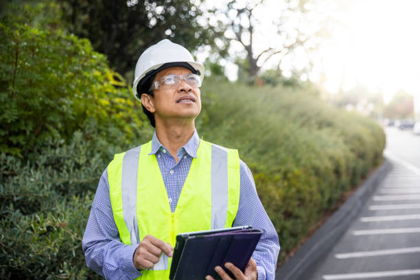 istock Mature Filipino Man with Tablet Inspecting a Building 1298681476
