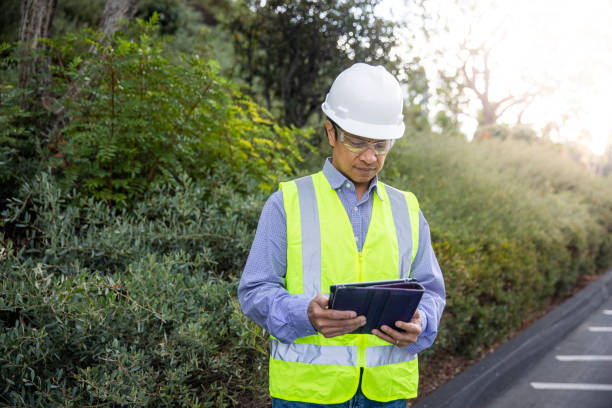 istock Mature Filipino Man with Tablet Inspecting a Building 1298681504