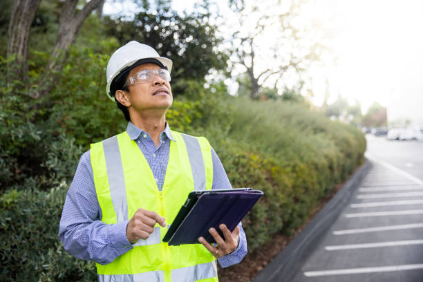istock Mature Filipino Man with Tablet Inspecting a Building 1298681685