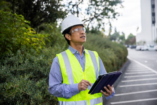 istock Mature Filipino Man with Tablet Inspecting a Building 1298681739