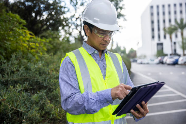 istock Mature Filipino Man with Tablet Inspecting a Building 1298681814