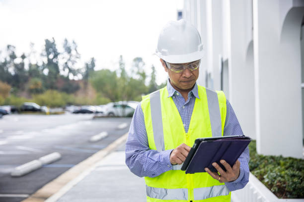 istock Mature Filipino Man with Tablet Inspecting a Building 1298682596