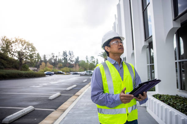 istock Mature Filipino Man with Tablet Inspecting a Building 1298682687