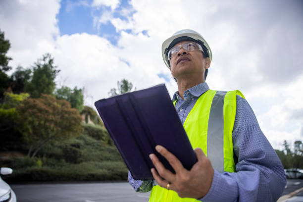 istock Mature Filipino Man with Tablet Inspecting a Building 1298682738