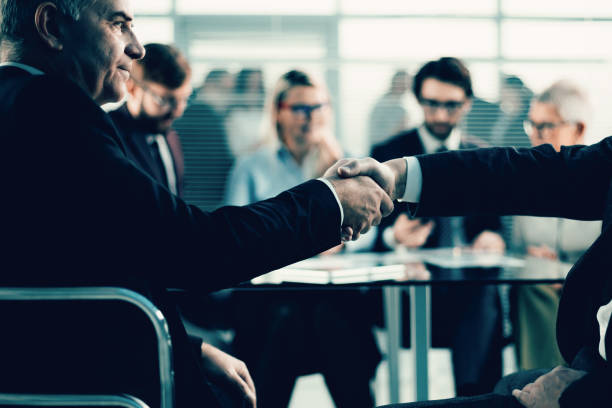 istock close up. business partners confidently shake hands 1298683182