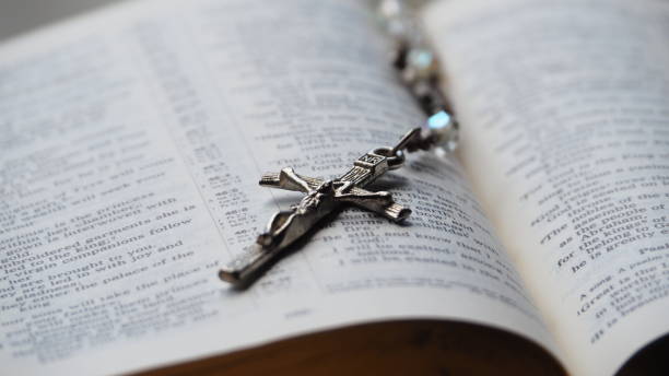 istock Jesus Cross pendant on Bible 1298683199