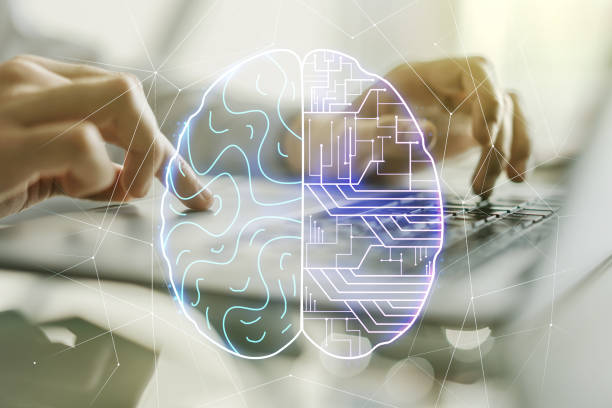 istock Double exposure of creative artificial Intelligence symbol with hands typing on laptop on background. Neural networks and machine learning concept 1298685886