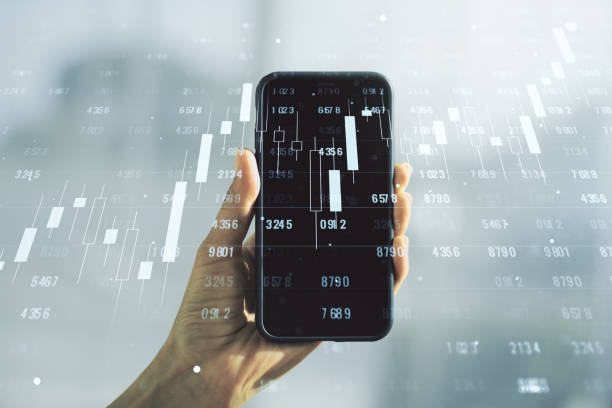 istock Multi exposure of creative statistics data hologram and hand with cell phone on background, stats and analytics concept 1298685892