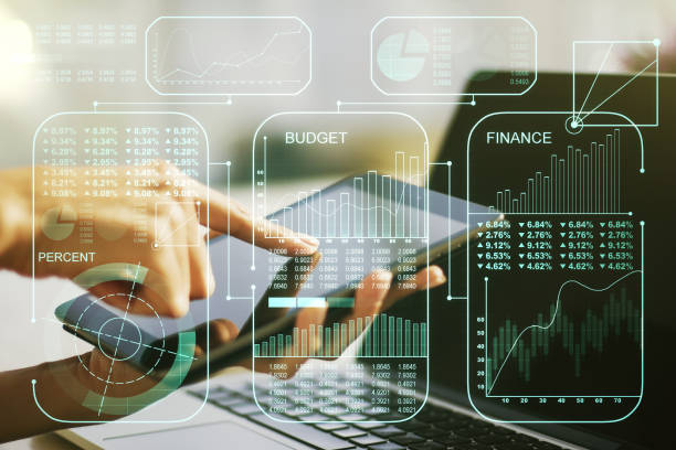 istock Multi exposure of abstract graphic data spreadsheet sketch and hand working with a digital tablet on background, analytics and analysis concept 1298686443
