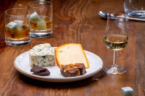 istock Tasting and pairing of different cheeses with strong alcoholic drinks, whisky, cognac or calvados 1298688802