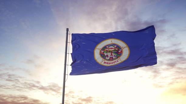istock State flag of Minnesota waving in the wind. Dramatic sky background. 3d illustration 1298689729